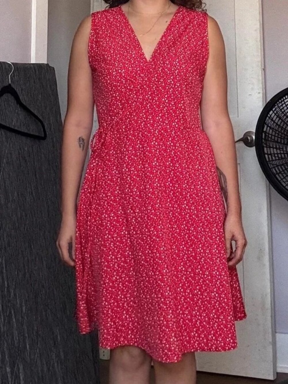 Red floral tie around dress